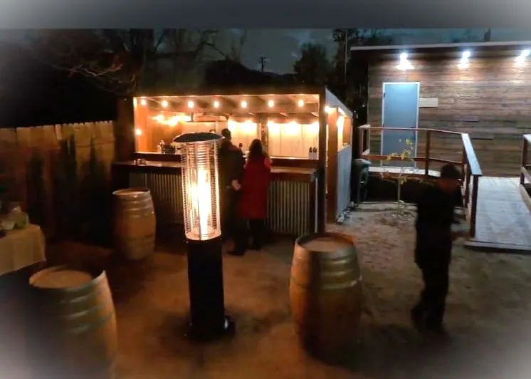 Inside the rustic corrugated barn bar — Rancho Lagunas outdoor ranch event venue in Bloomington, California