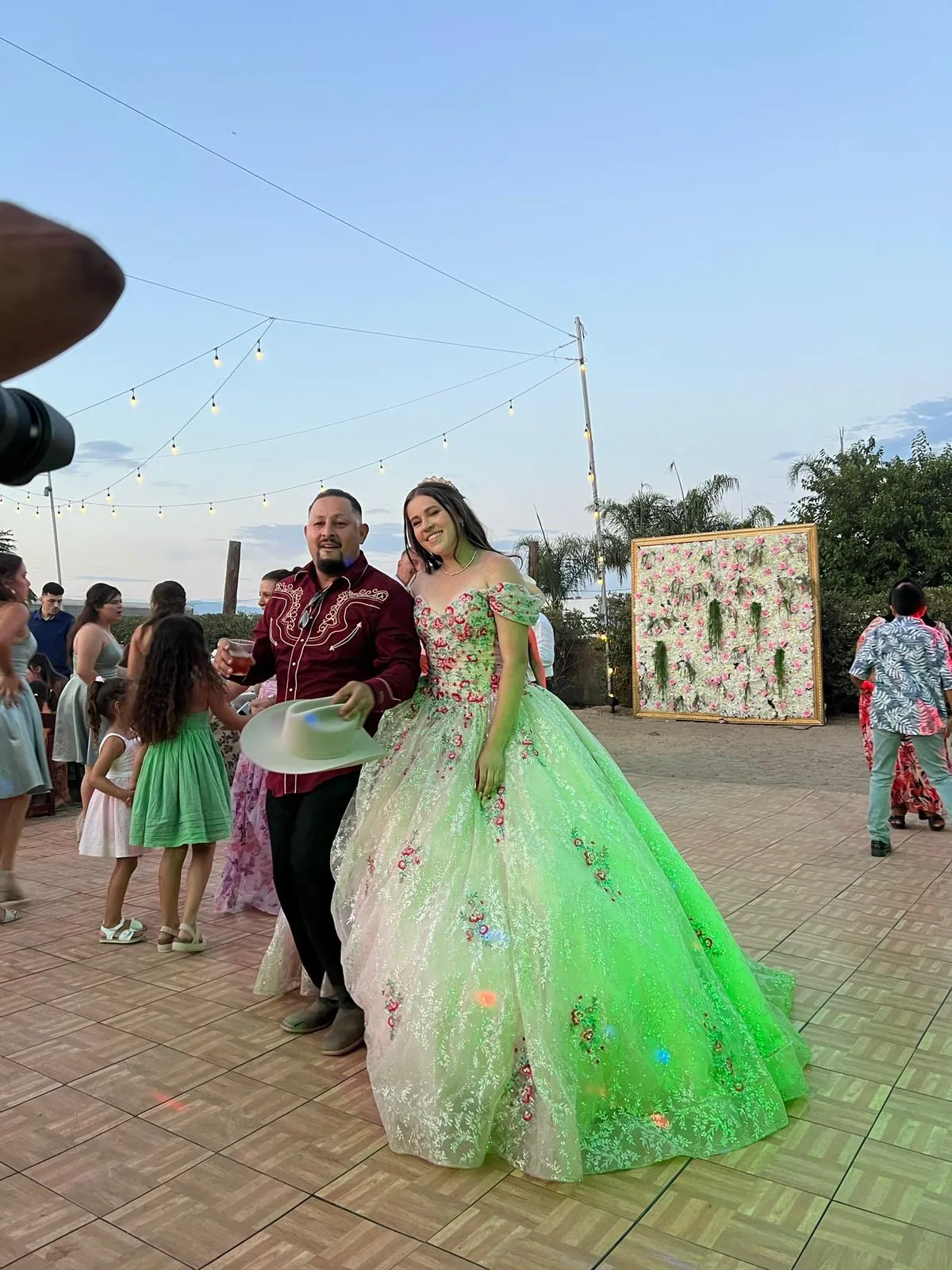 Quinceañera in an emerald gown on the grounds — Rancho Lagunas outdoor ranch event venue in Bloomington, California